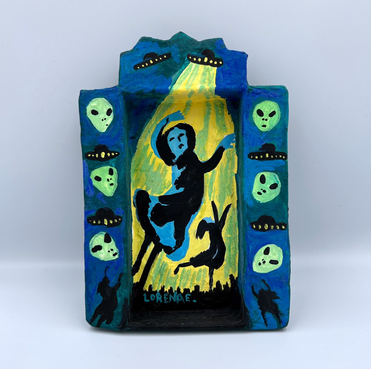 Lorena Eliasen’s “Alien Abduction”, Only at the ‘Faces In The Crowd’ FolkArtwork Exhibit