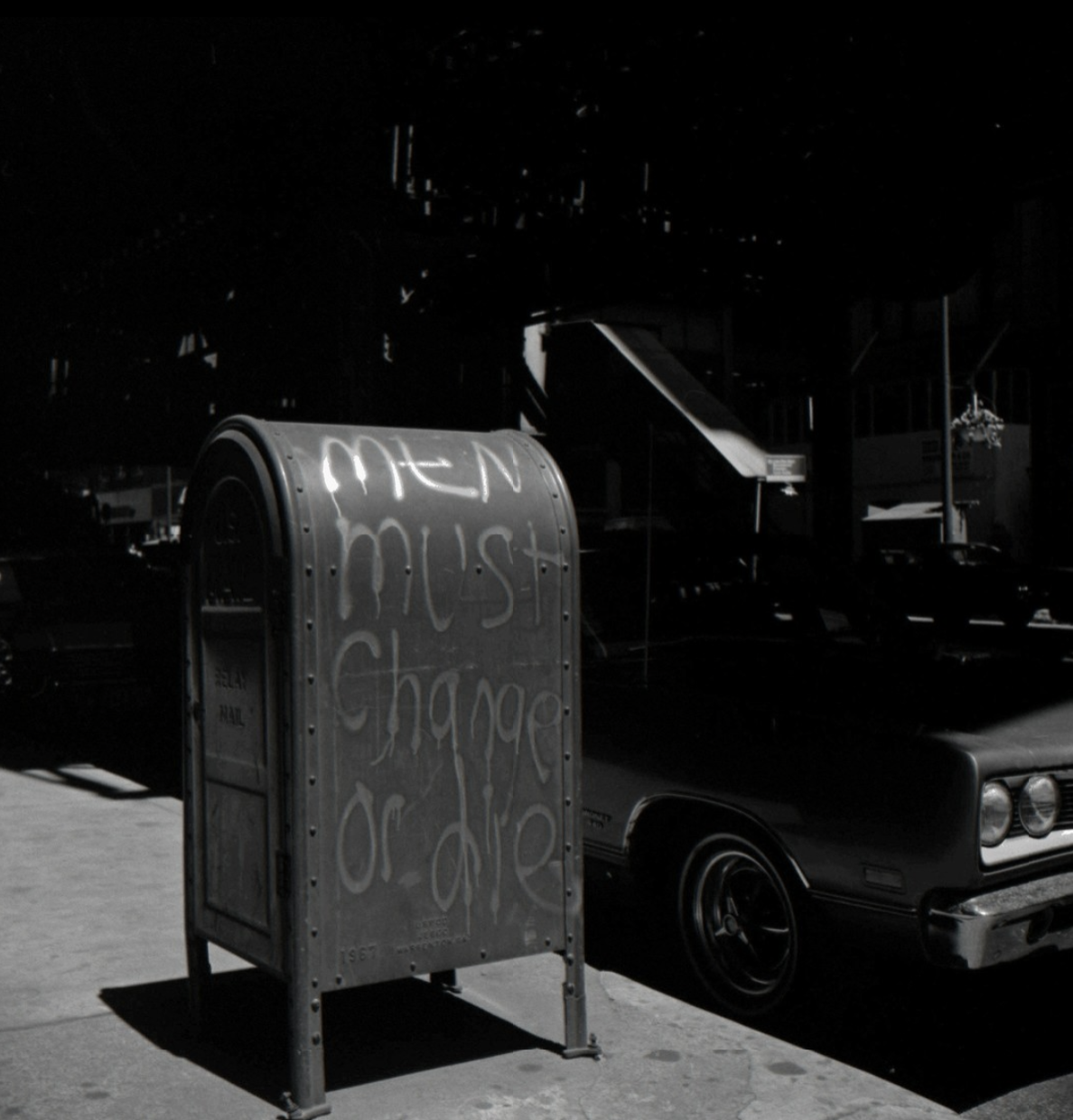 Daily Art: VIVIAN MAIER’s “Men Must Change” Photograph